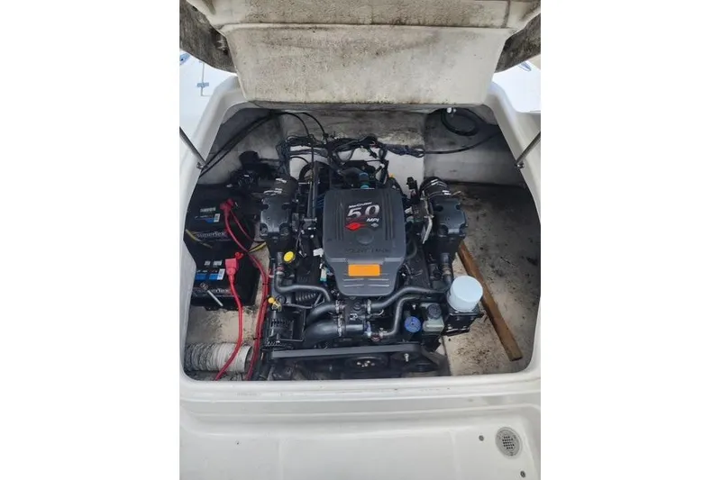 Slide: The Image of Engine compartment of a 2008 Chaparral Sunesta 224 boat, showcasing the motor and components. - 6