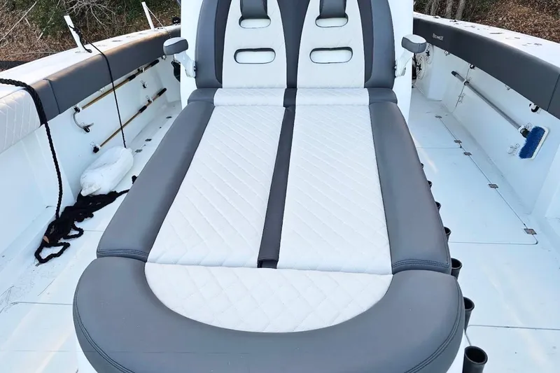 Slide: The Image of Luxurious seating on a 2020 Freeman 42LR boat, featuring gray and white upholstery. - 8