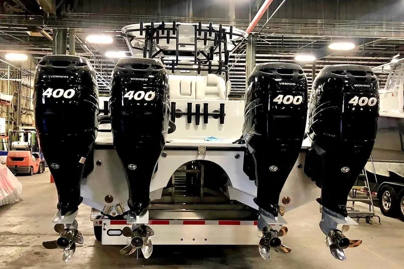 Slide: The Image of Freeman 42LR 2020 boat with four powerful 400 horsepower outboard engines in a warehouse. - 2