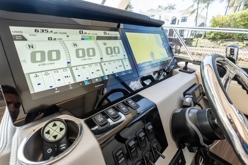 Slide: The Image of Dashboard of 2022 Regal 42 XO yacht with advanced navigation displays. - 42