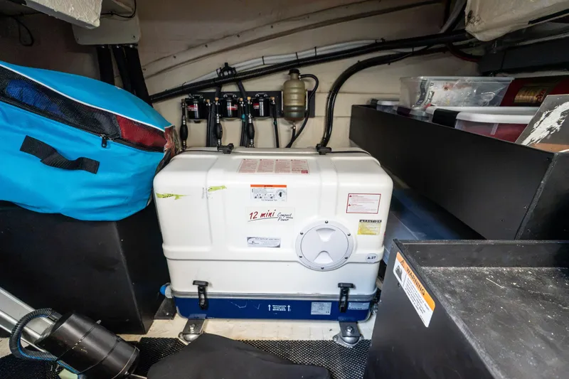 Slide: The Image of Engine room of 2022 Regal 42 XO yacht with equipment and storage. - 62