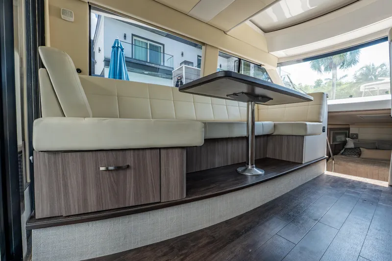 Slide: The Image of Luxurious interior of 2022 Regal 42 XO yacht with elegant seating and table. - 32