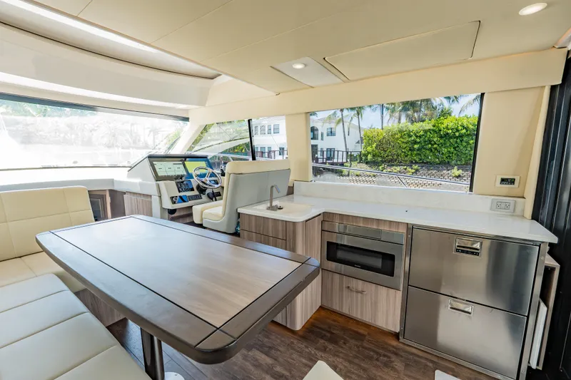 Slide: The Image of Luxurious interior of 2022 Regal 42 XO yacht with modern kitchen and seating area. - 39