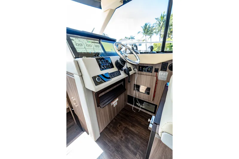 Slide: The Image of Helm of 2022 Regal 42 XO yacht with modern controls and steering wheel. - 41