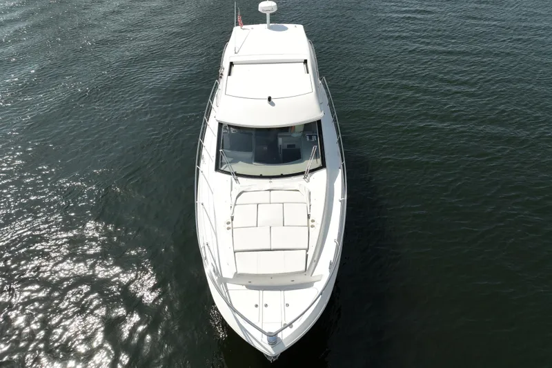 Slide: The Image of Aerial view of 2022 Regal 42 XO yacht cruising on open water. - 12
