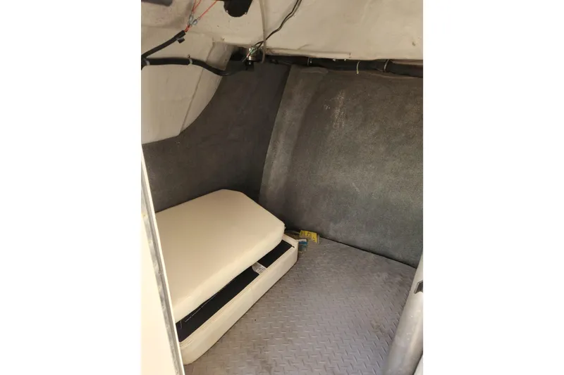 Slide: The Image of Interior cabin of 2015 Grady-White Freedom 307 boat, featuring cushioned seating. - 21
