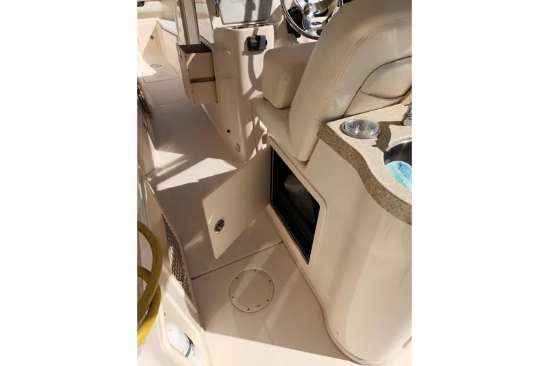 Slide: The Image of Interior view of a 2015 Grady-White Freedom 307 boat, featuring seating and storage. - 22