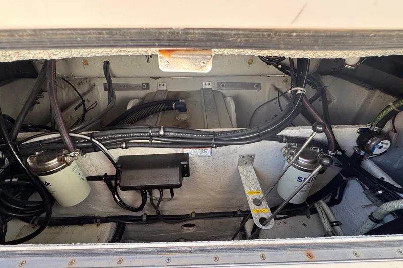 Slide: The Image of Engine compartment of a 2015 Grady-White Freedom 307 boat, showing wiring and components. - 29
