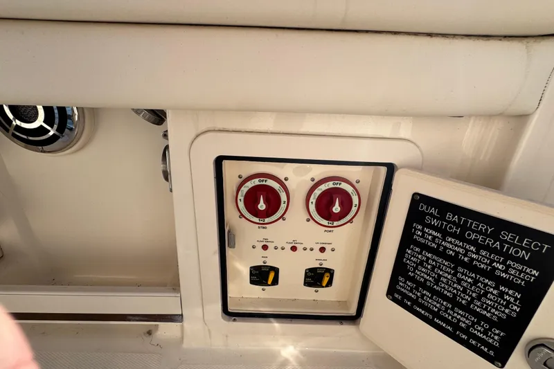Slide: The Image of Control panel of a 2015 Grady-White Freedom 307 boat with dual battery switches. - 27