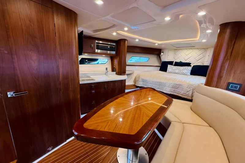 Slide: The Image of Luxurious interior of 2021 Intrepid 410 Evolution yacht with wood finishes and modern amenities. - 40