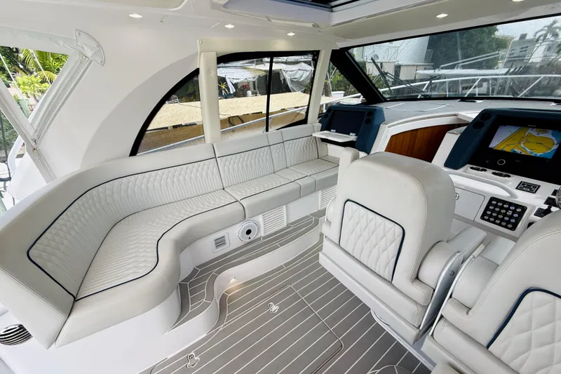 Slide: The Image of Luxurious interior of 2021 Intrepid 410 Evolution yacht with plush seating and advanced navigation systems. - 23