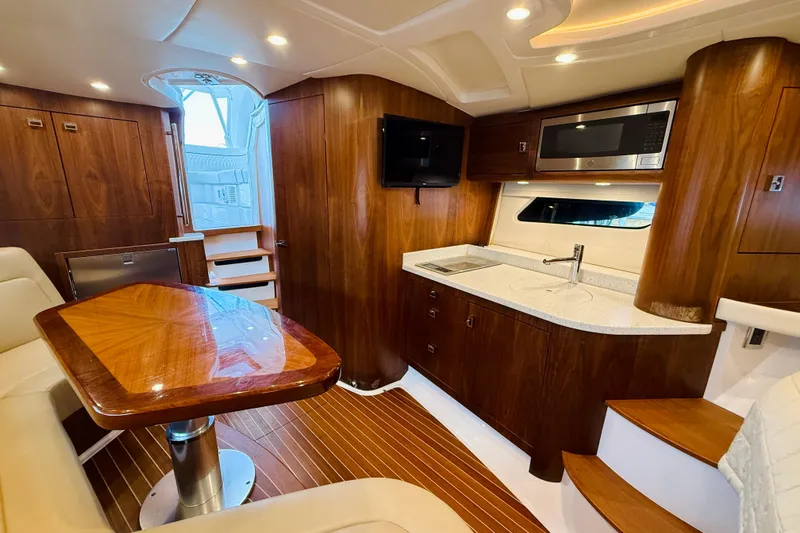 Slide: The Image of Luxurious interior of 2021 Intrepid 410 Evolution yacht with wood finishes and modern amenities. - 43