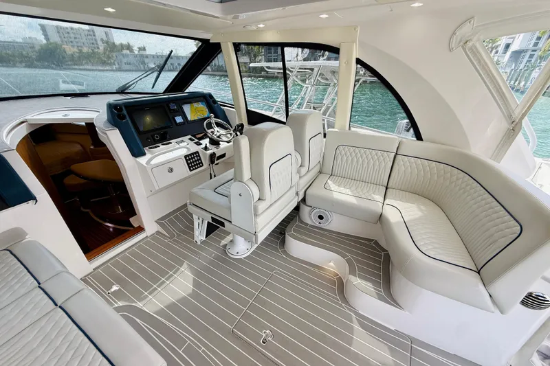 Slide: The Image of Luxurious interior of 2021 Intrepid 410 Evolution yacht with plush seating and modern helm. - 22