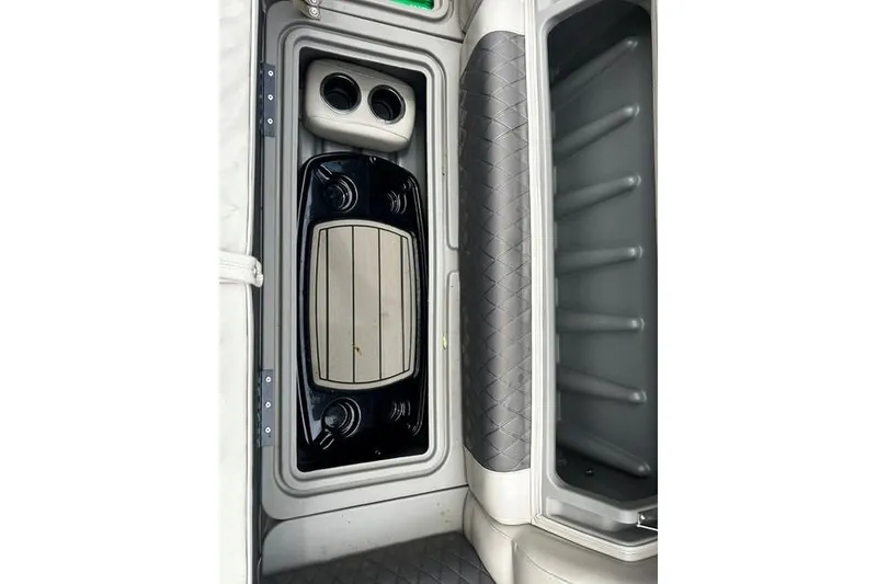 Slide: The Image of 2020 Sun Tracker SportFish 22 XP3 boat interior with storage compartments and cup holders. - 5