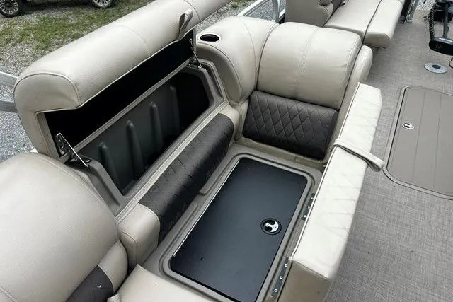 Slide: The Image of 2020 Sun Tracker SportFish 22 XP3 boat interior with open storage compartment. - 7