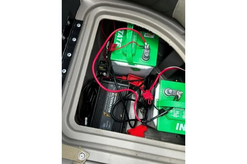 Slide: The Image of Battery compartment of 2020 Sun Tracker SportFish 22 XP3 with wiring and alternator. - 4