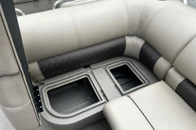 Slide: The Image of 2020 Sun Tracker SportFish 22 XP3 boat seating with under-seat storage compartments. - 10