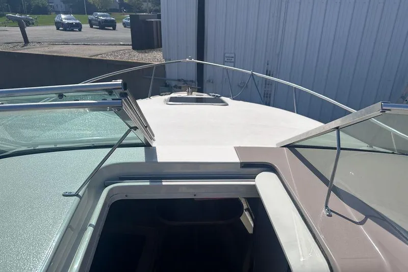 Slide: The Image of 1999 Chaparral Signature 240 boat deck with open hatch and windshield. - 5