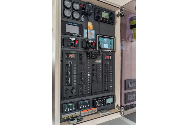 Slide: The Image of Electrical control panel of a 2021 Leopard 43 Powercat yacht, featuring gauges and switches. - 32