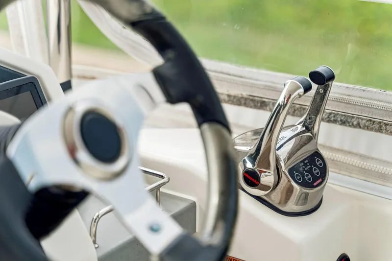Slide: The Image of Steering wheel and throttle controls on 2021 Leopard 43 Powercat yacht. - 15