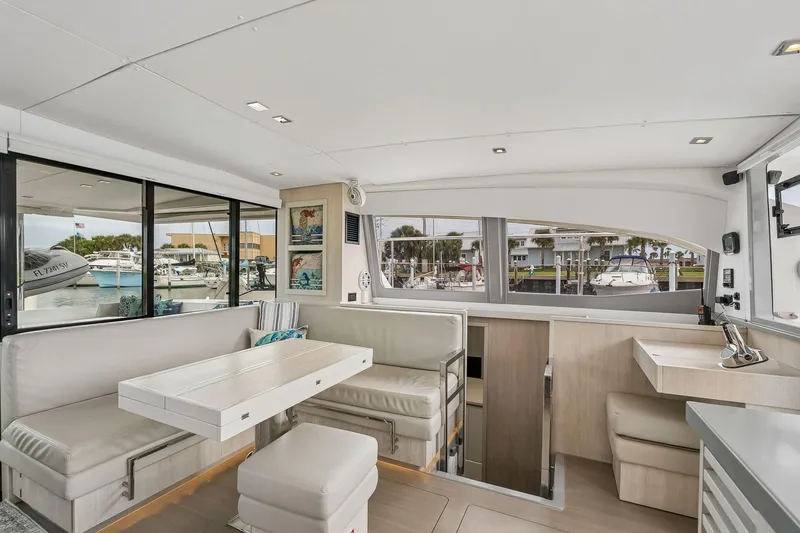 Slide: The Image of Interior of 2021 Leopard 43 Powercat yacht with modern seating and large windows. - 25