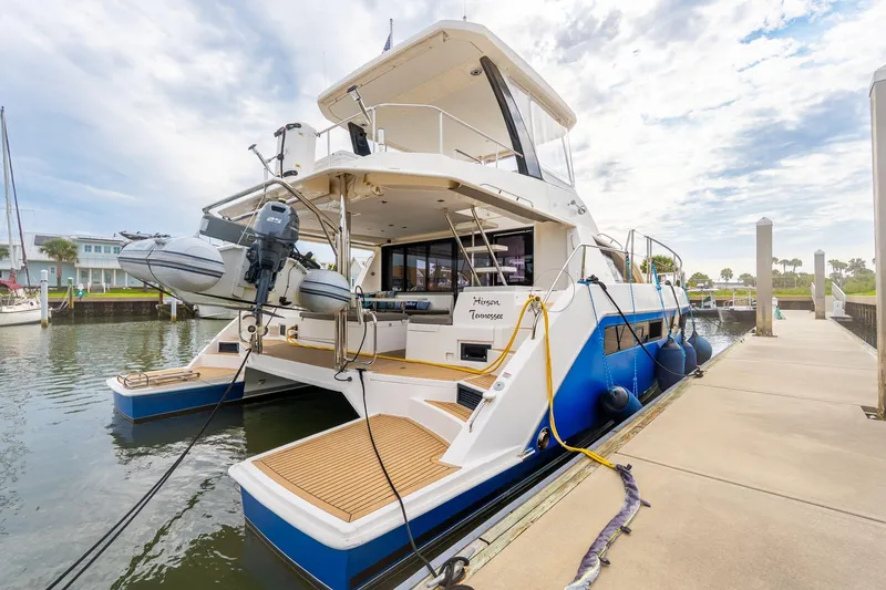 Slide: The Image of 2021 Leopard 43 Powercat docked, showcasing sleek design and modern features. - 2