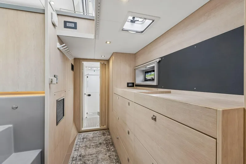 Slide: The Image of Interior of 2021 Leopard 43 Powercat, featuring modern cabinetry and sleek design elements. - 37