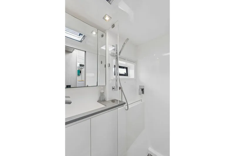 Slide: The Image of Modern bathroom interior on 2021 Leopard 43 Powercat yacht, featuring sleek fixtures and white decor. - 39