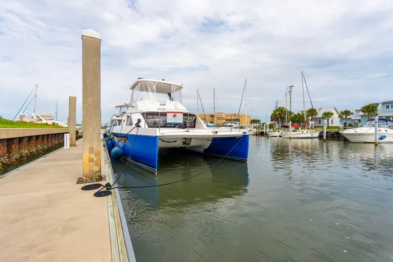Slide: The Image of 2021 Leopard 43 Powercat docked at marina, showcasing sleek design and modern features. - 7