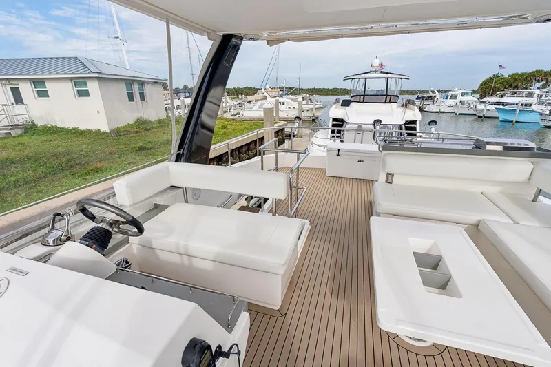 Slide: The Image of Leopard 43 Powercat 2021 yacht interior with sleek seating and modern helm station. - 12
