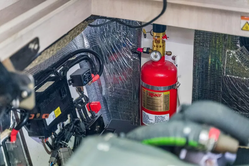 Slide: The Image of Engine room of 2021 Leopard 43 Powercat with fire extinguisher and wiring. - 53