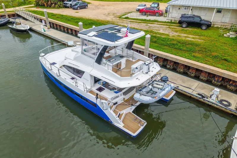 Slide: The Image of 2021 Leopard 43 Powercat yacht docked at marina with solar panels. - 47