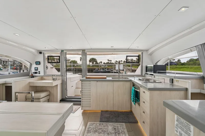 Slide: The Image of Luxurious interior of 2021 Leopard 43 Powercat yacht with modern kitchen and seating area. - 4