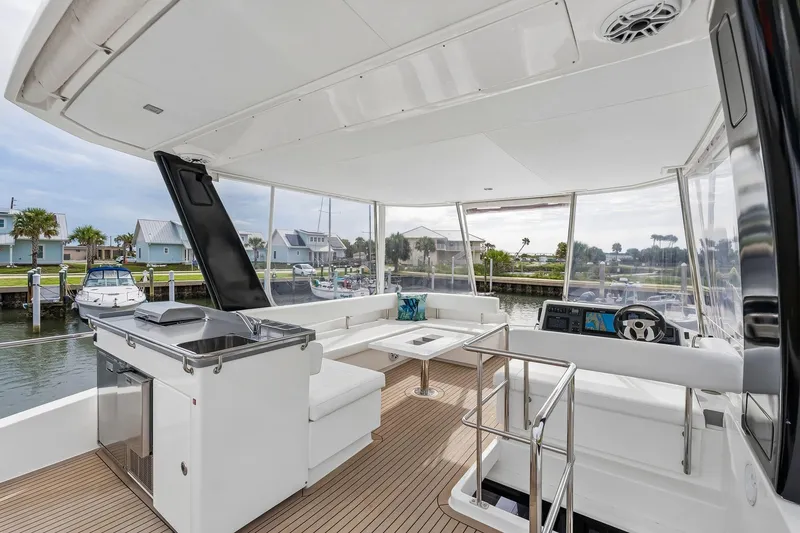 Slide: The Image of Luxurious 2021 Leopard 43 Powercat yacht interior with modern seating and navigation area. - 11