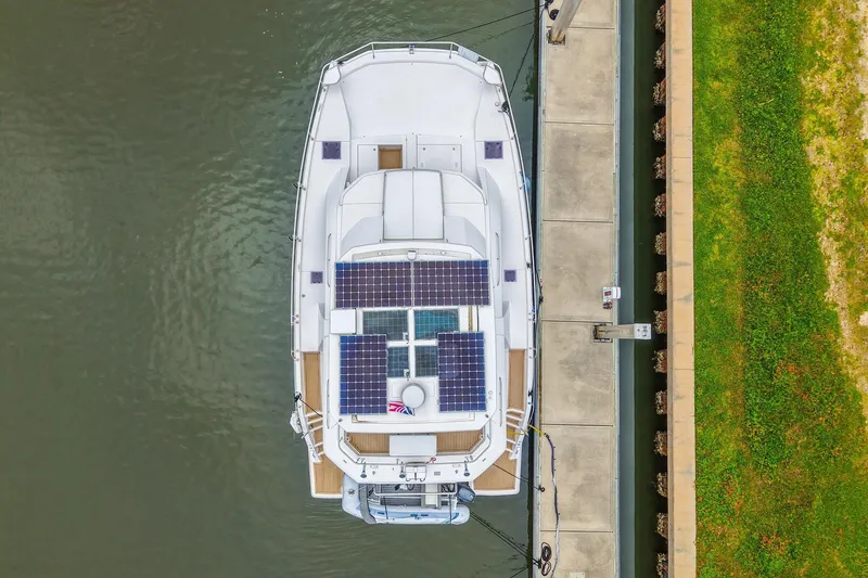 Slide: The Image of Aerial view of 2021 Leopard 43 Powercat docked, featuring solar panels on the deck. - 48