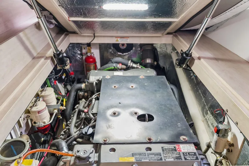Slide: The Image of Engine compartment of a 2021 Leopard 43 Powercat, showcasing mechanical components and wiring. - 52