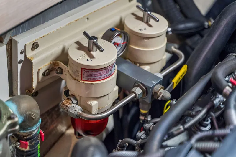 Slide: The Image of Engine compartment of 2021 Leopard 43 Powercat with dual fuel filters and gauge. - 54