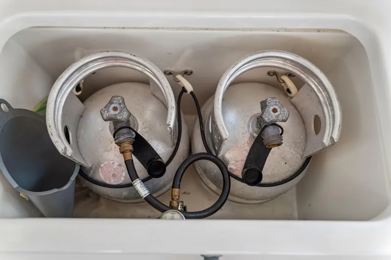 Slide: The Image of Propane tanks in storage compartment of 2021 Leopard 43 Powercat boat. - 59