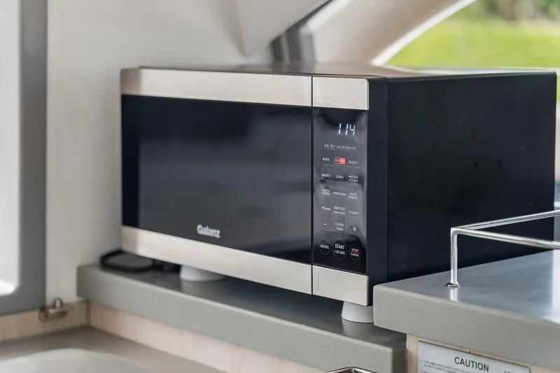 Slide: The Image of Galanz microwave in 2021 Leopard 43 Powercat kitchen interior. - 33