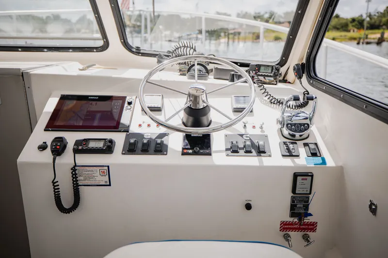 Slide: The Image of The helm of a 2019 Newton 36' Dive Special boat with modern electronics. - 14