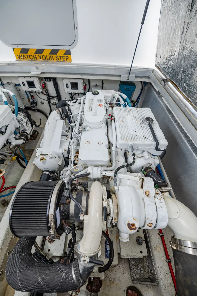 Slide: The Image of Engine room of a 2019 Newton 36' Dive Special boat with visible machinery. - 33