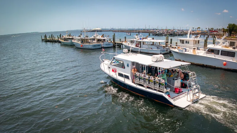 Slide: The Image of A 2019 Newton 36' Dive Special boat is on the water in a harbor. - 3