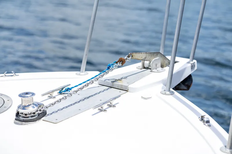 Slide: The Image of The image shows the bow of a boat with anchor chain and windlass. - 25