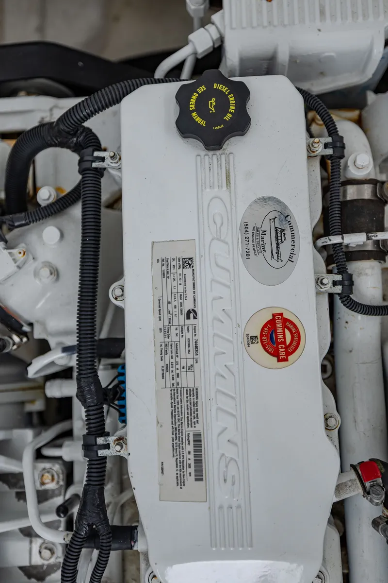 Slide: The Image of Close-up of a Cummins engine with stickers and cables. - 35