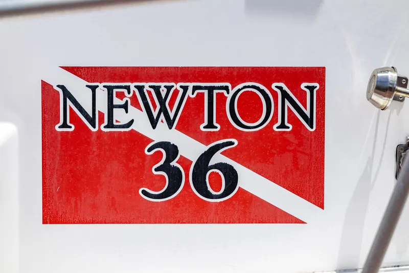 Slide: The Image of Close-up of the "Newton 36" logo on a boat. - 24