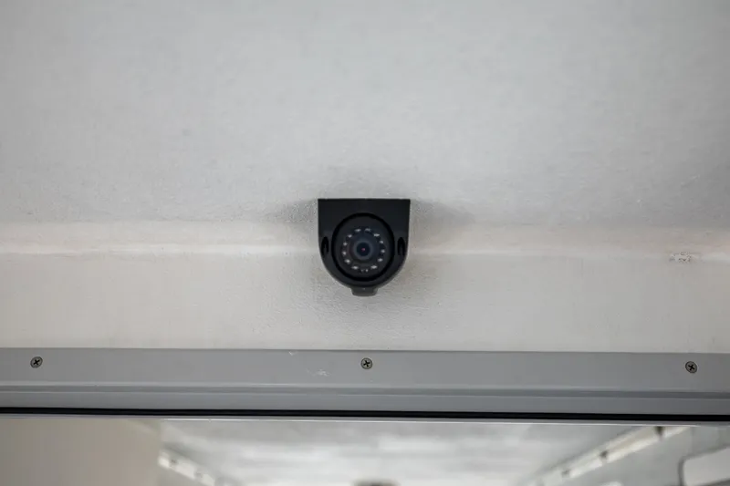 Slide: The Image of A surveillance camera is mounted on the ceiling of a boat. - 28