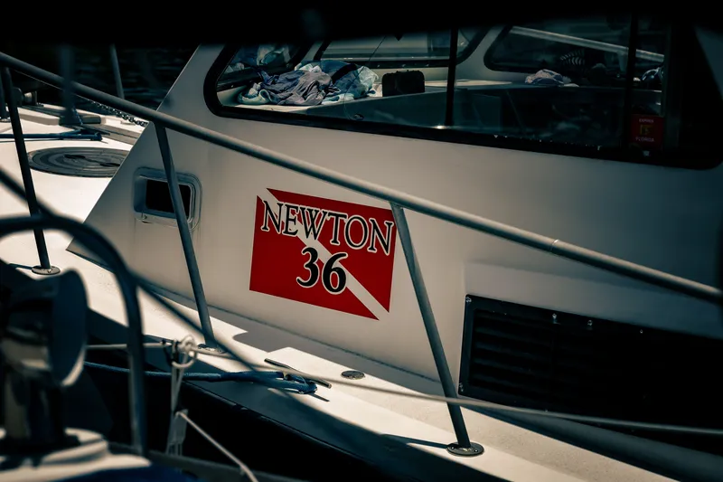 Slide: The Image of A 2019 Newton 36' dive boat docked at a harbor. - 4
