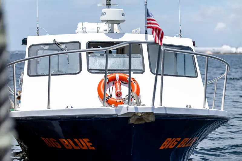 Slide: The Image of A 2019 Newton 36' Dive Special boat named "Big Blue" is on the water. - 23