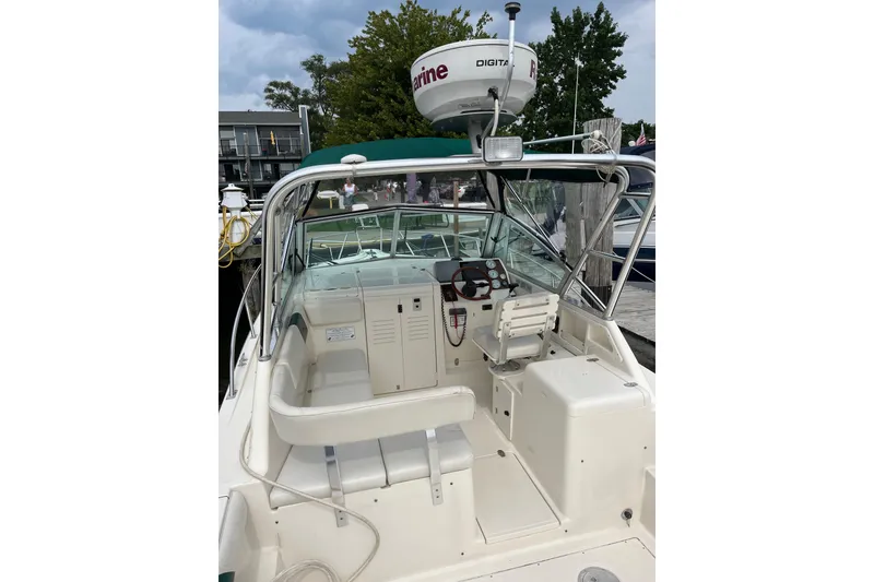 Slide: The Image of 2000 Pursuit 2860 Denali boat interior with helm, seating, and radar equipment. - 7