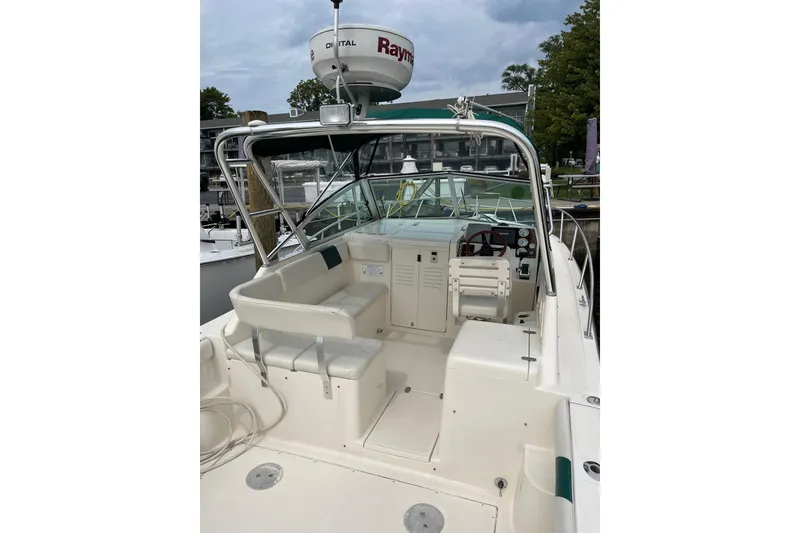 Slide: The Image of 2000 Pursuit 2860 Denali boat interior with seating and navigation equipment. - 8